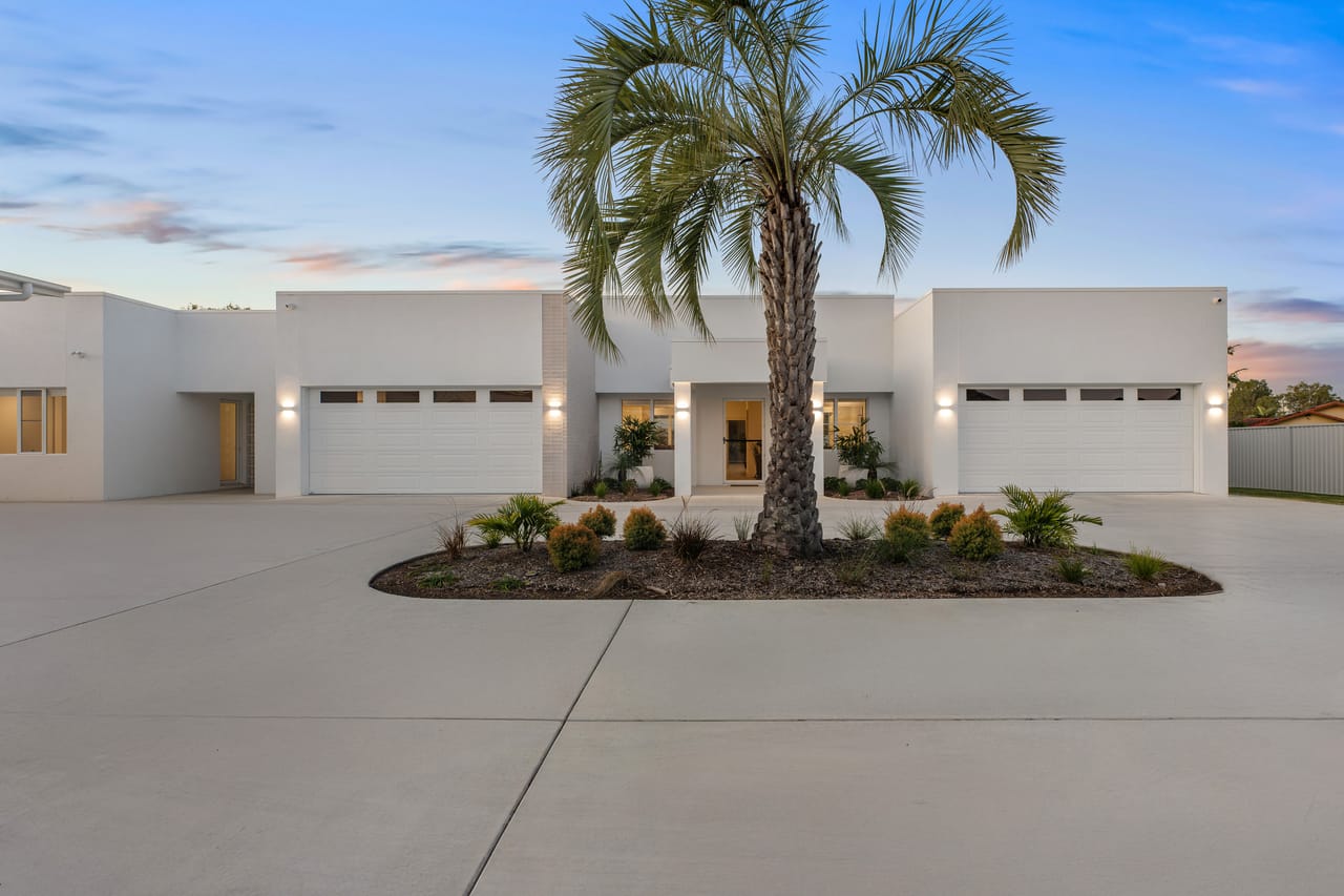 The Hide Away, Little Mountain, sold by RYDE Realty: the home's arrival court and frontage at dusk
